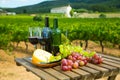 Red wine, cheese and grapes on wooden table Royalty Free Stock Photo