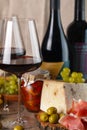 Wine, cheese and jamon still life. Vertical Royalty Free Stock Photo