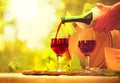 Red wine and cheese. Pouring wine closeup Royalty Free Stock Photo