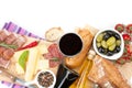 Red wine with cheese, prosciutto, bread, vegetables and spices Royalty Free Stock Photo