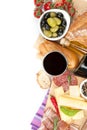 Red wine with cheese, prosciutto, bread, vegetables and spices Royalty Free Stock Photo