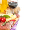 Red wine with cheese, prosciutto, bread, vegetables and spices Royalty Free Stock Photo