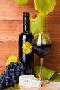 Red wine with cheese snack and blue grape Royalty Free Stock Photo