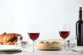 Red wine and delicious dinner served on light table Royalty Free Stock Photo