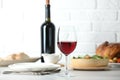 Red wine and delicious dinner served on light table Royalty Free Stock Photo
