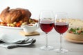 Red wine and delicious dinner served on light table Royalty Free Stock Photo