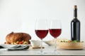 Red wine and delicious dinner served on light table Royalty Free Stock Photo