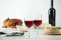 Red wine and delicious dinner served on light table Royalty Free Stock Photo