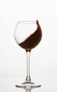 Red wine diagonal wave, curl is in stemmed glass.