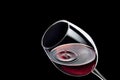 red wine drop falling in glass and created splash Royalty Free Stock Photo