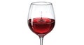 Red wine drop falling into a glass creating ripples and splashes, isolated Royalty Free Stock Photo