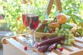 Red wine with fruits and grapes