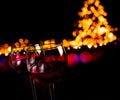 Red wine glass against bokeh lights background Royalty Free Stock Photo
