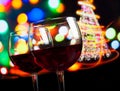 Red wine glass against bokeh lights tree background Royalty Free Stock Photo