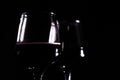 red wine in glass on the black background