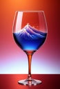 a red wine glass with a blue liquid inside of it Royalty Free Stock Photo