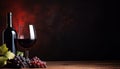 Red wine glass and bottle on wooden table with copy space on black background Royalty Free Stock Photo