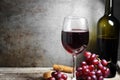 Red Wine Glass And Bottle On Wooden Table Royalty Free Stock Photo