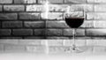 Red wine in a glass on a brick wall background,close-up. Royalty Free Stock Photo