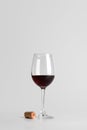 Red Wine Glass with Cork on Minimal Background Royalty Free Stock Photo