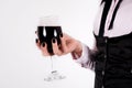 Red wine glass in elegant female hand with black nails Royalty Free Stock Photo