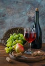 Red wine in glass and fruit Royalty Free Stock Photo