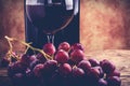 Red wine glass grapes and bottle Royalty Free Stock Photo