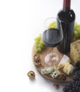 Red wine, glass, grapes, cheese and nuts Royalty Free Stock Photo