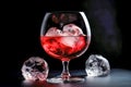 red wine in glass with ice cubes on black background, close up. Generative AI Royalty Free Stock Photo