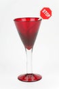 Red wine glass and sign stop