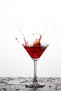 Red Wine Glass With Splashes Against White Background. Royalty Free Stock Photo