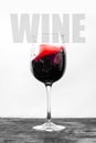 Red wine in the glass splashes in motion on a white background. Stylish design drink card with text Royalty Free Stock Photo