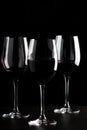 Red wine glasses on black background Royalty Free Stock Photo