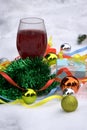 Red wine glasses and christmas balls on snow Royalty Free Stock Photo