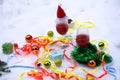 Red wine glasses and christmas balls on snow Royalty Free Stock Photo