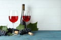 Red wine, grape, cork and corkscrew on wooden table Royalty Free Stock Photo