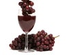 Red wine and grapes on white background Royalty Free Stock Photo