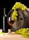 Red wine and green grape and barrel Royalty Free Stock Photo