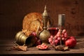 Red wine, juicy pomegranate, sweet grapes, flat cake and copper Royalty Free Stock Photo