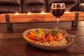 Red wine with Maine lobster over a bed of linguini with micro greens