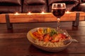 Red wine with Maine lobster over a bed of linguini with micro greens