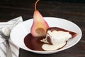 Red Wine Poached Pears with Dark Chocolate & Vanilla Cream Royalty Free Stock Photo