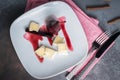 Red Wine Poached Pears in the white plate with cheese and cinnamon Royalty Free Stock Photo