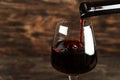 In a glass pour red wine Royalty Free Stock Photo