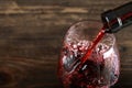 Red wine is poured from a bottle Royalty Free Stock Photo
