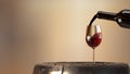 Red wine poured from a bottle into a wine glass. 3D rendering