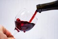 Red wine is poured into a glass beaker, large Royalty Free Stock Photo