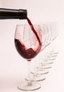 Red wine is poured into a glass Royalty Free Stock Photo