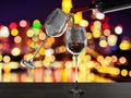 Red wine poured into a two glass with bokeh background