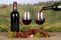 Red wine pouring from a bottle into a glass Royalty Free Stock Photo